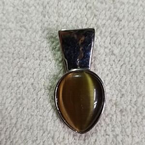 Silvertone brown cats eye slide pendant